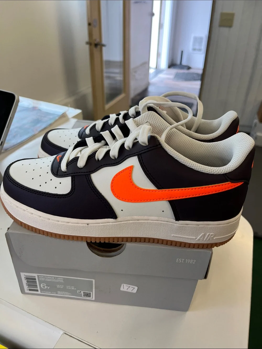 Nike Air Force 1’s Men’s Low-Top Sneakers - Black/White with Orange Swoosh